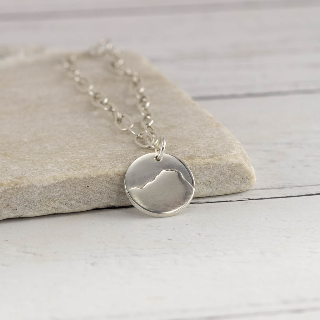 Silver bracelet of Raven Crag in the Lake District on a stone surface